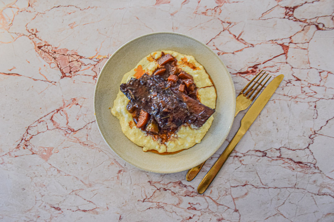 Hearty Slow-Cooked Short Ribs Ragu on Creamy Polenta